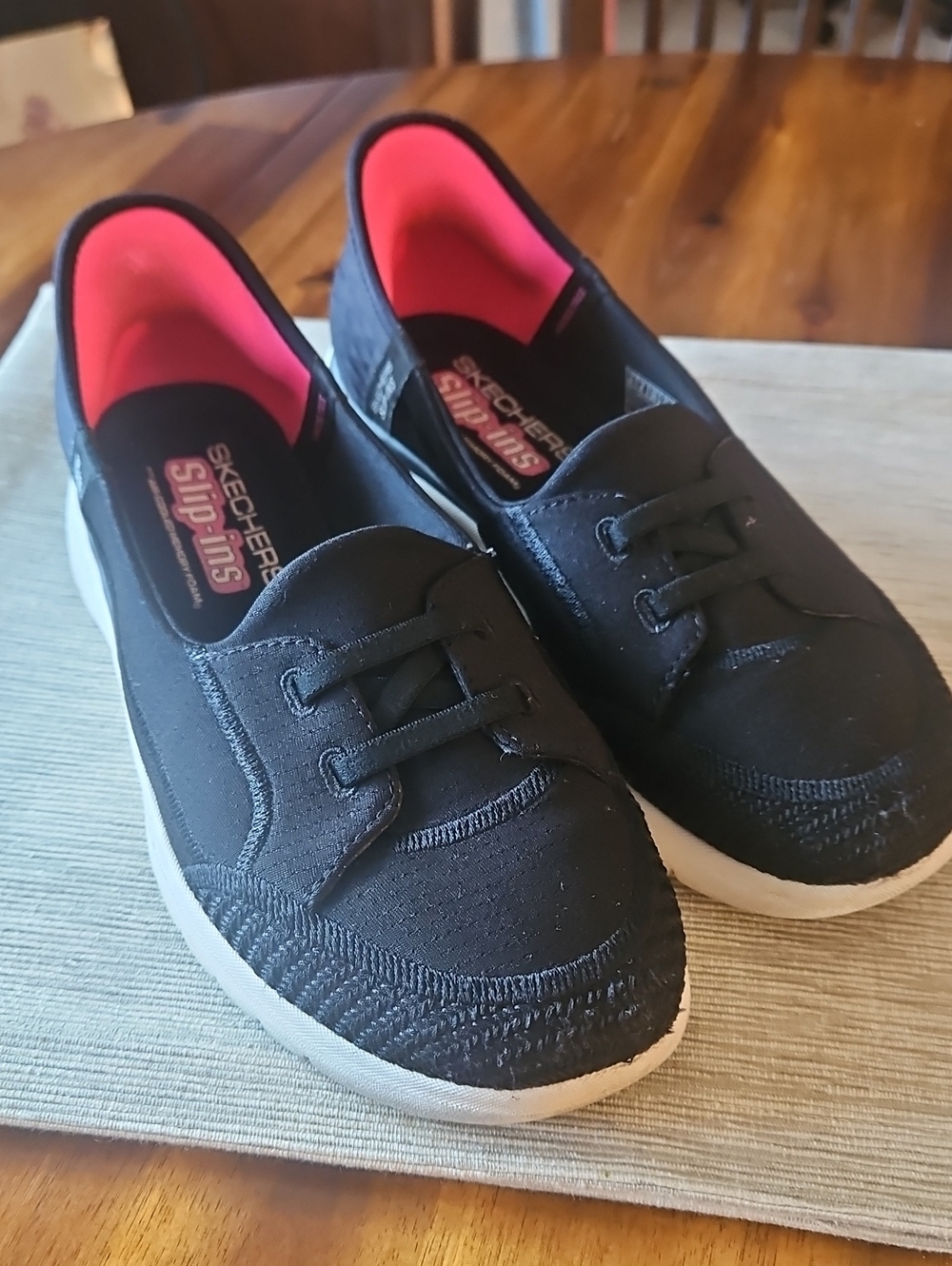 Skechers Women's Black Slip-On Sneakers with Pink Lining